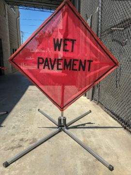 Show details for Road Sign - Wet Pavement Ahead Picture of Road Sign - Wet Pavement Ahead